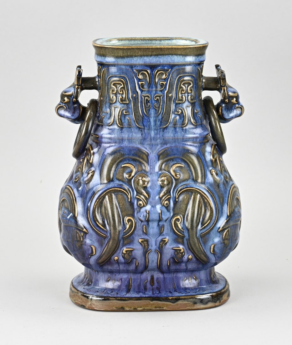 Chinese vase, H 25 cm.: Chinese porcelain celadon ear vase with animal heads + relief. Dimensions: H 25 cm. In good condition.