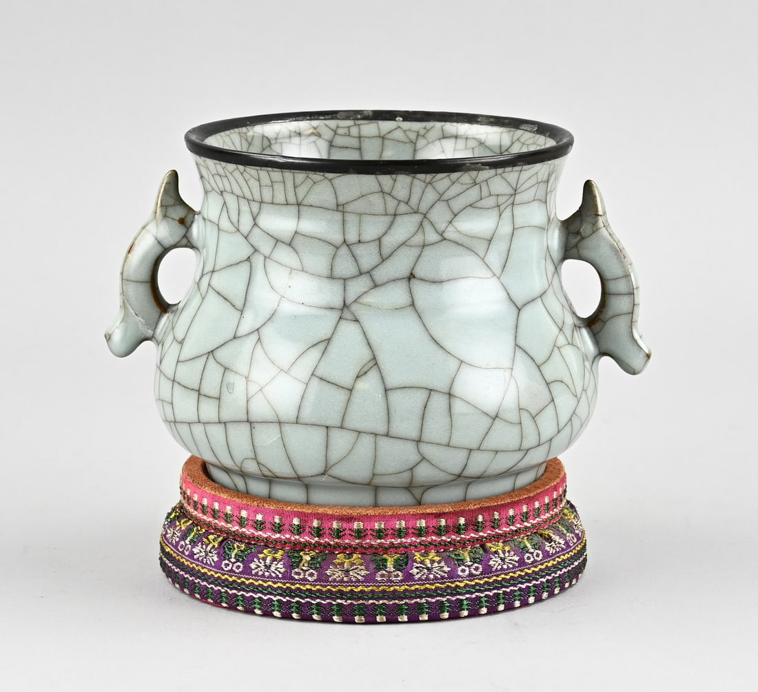 Chinese celadon ear vase on console: Old Chinese celadon ear vase in Sung style, with incised Chinese text on the base. Mounted on a colorful console. Dimensions: H 11 x Ø 13 cm. In good condition.