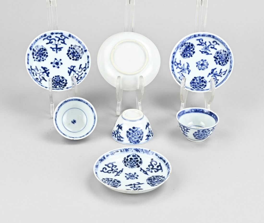 Set of Chinese cups/saucers: Set of 18th-19th century Chinese porcelain cups and saucers. Floral decoration. Kang Xi style. Three saucers in good condition, one saucer chipped. Three cups in good condition, slight rim chipping.