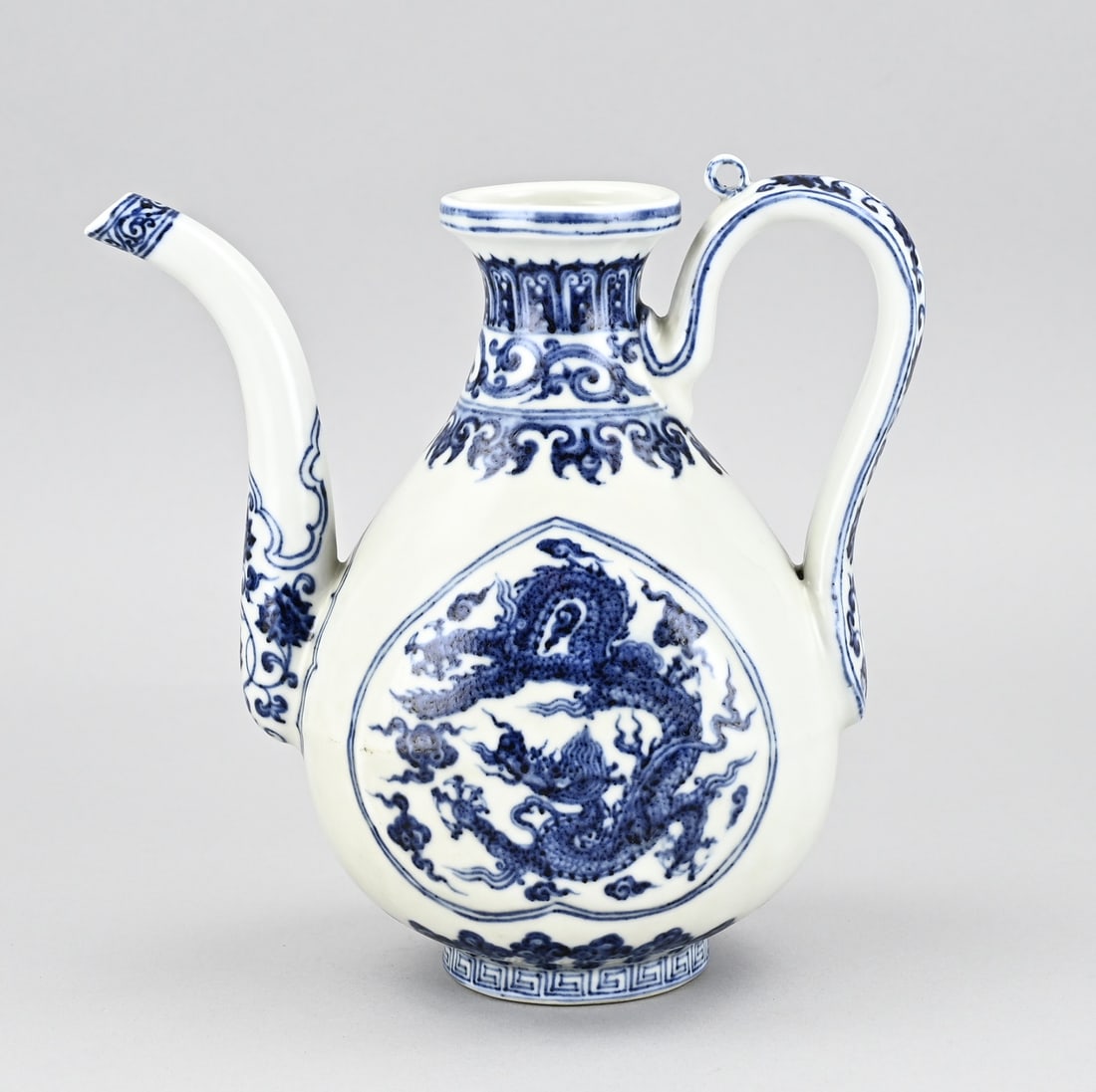 Chinese pitcher, H 22 cm.: Old Chinese porcelain pitcher with dragons and floral decoration. Dimensions: H 22 cm. In good condition.