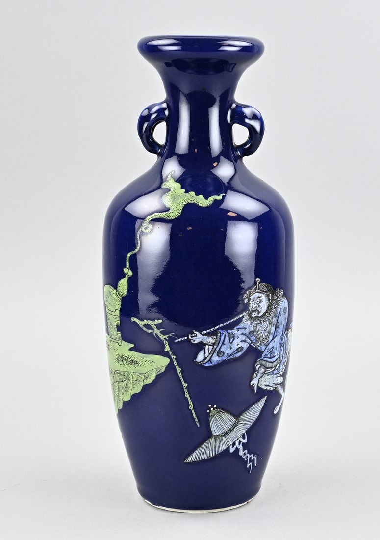 Chinese vase, H 33 cm.: 19th-century Chinese porcelain ear vase with blue glaze and relief figure decoration. Dimensions: H 33 cm. In good condition.