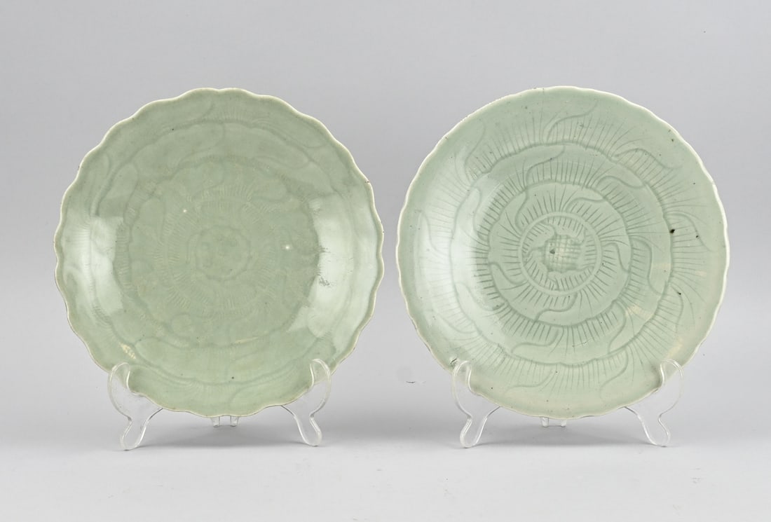 2x Celadon plate Ø 23.6 cm.: Two antique Chinese porcelain celadon plates with floral relief decoration. Dimensions: Ø 23.6 cm. In good condition.
