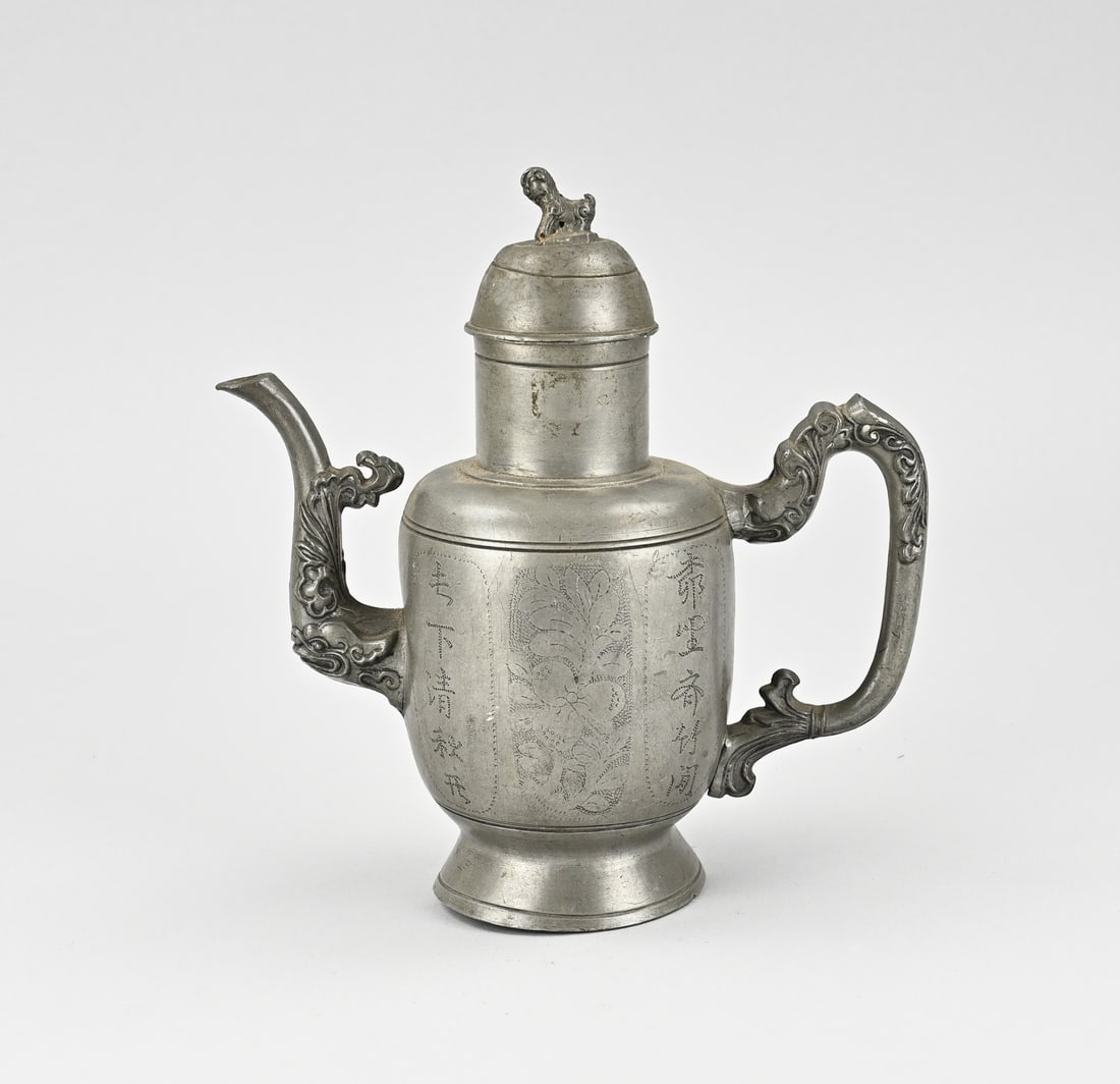 Chinese tin teapot: Antique Chinese pewter pitcher in Swatow style. However, circa 1900. With base mark, floral and text decoration. Dimensions: 20 cm. In good condition.