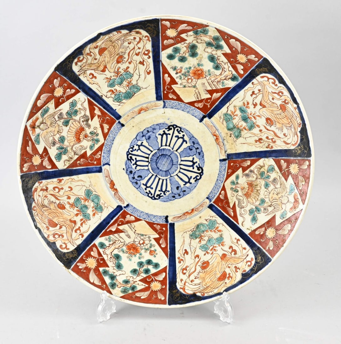 Large Japanese Imari bowl Ø 46 cm.: 19th-century Japanese porcelain Imari dish with stage-style decoration. Bird/landscape decoration. Dimensions: Ø 46 cm. In good condition.