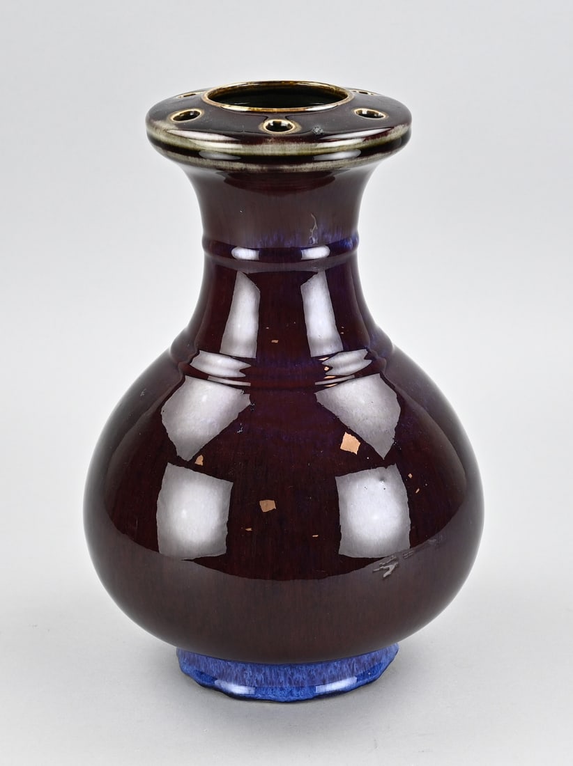 Chinese vase, H 33 cm.: Old, unusual Chinese sang de boeuf vase with holes in the rim (flower holder?). Dimensions: H 33 cm. In good condition.
