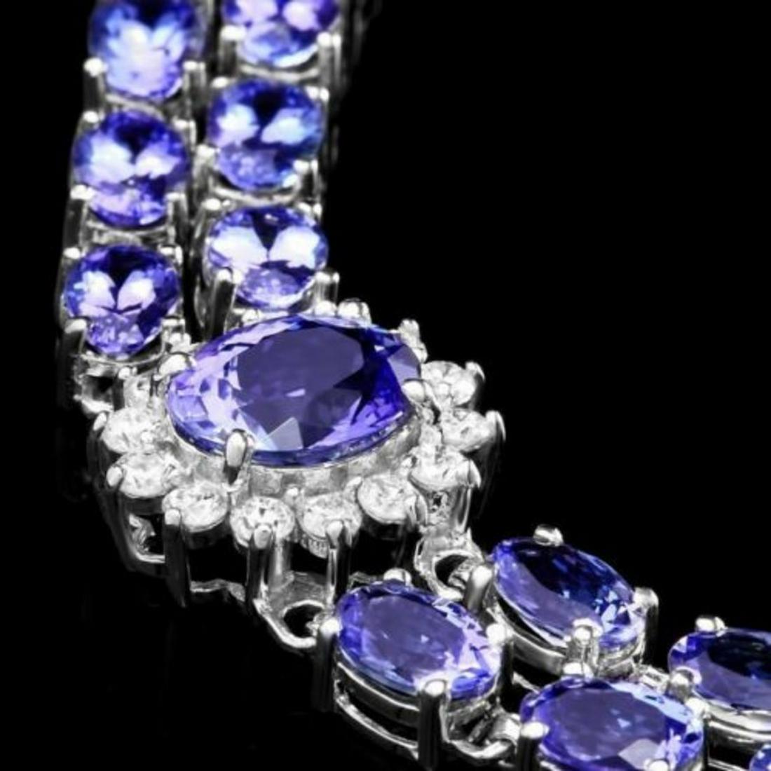 14k 21.63ct Tanzanite 1.69ct Diamond Bracelet: Retail: $18,500.00 ****** 14k 21.63ct Tanzanite 1.69ct Diamond Bracelet ****** Size: 7 / Metal: 14k Solid White Gold / Total Item Weight: 20.9 grams / Country Made: United States / / Main Stone: Tanza