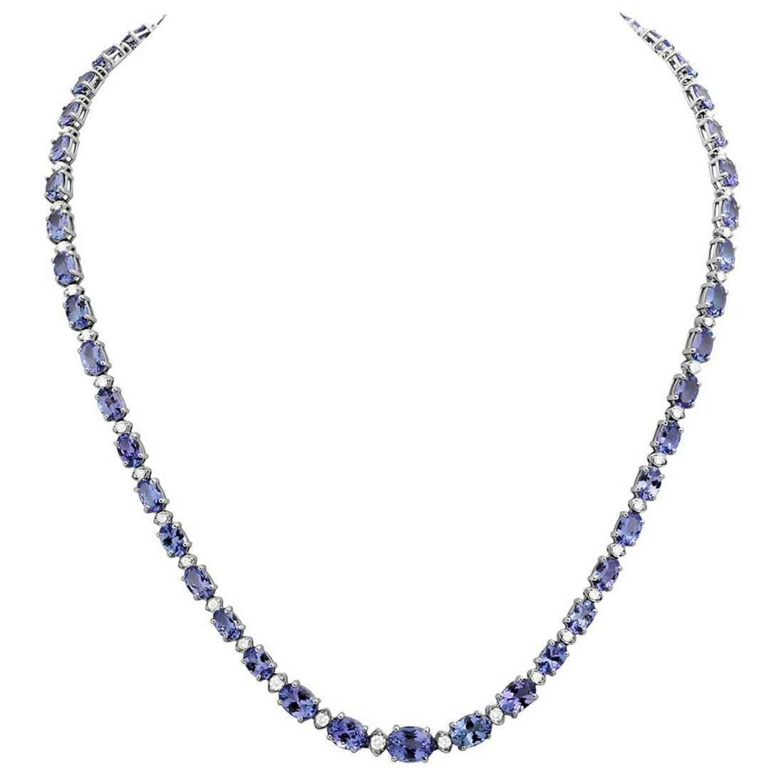14k White Gold 23.93ct Tanzanite 1.14ct Diamond Necklace: Retail: $18,500.00 ****** 14k White Gold 23.93ct Tanzanite 1.14ct Diamond Necklace ****** Metal: 14K White Gold / Total Item Weight: 20.80 grams / Country Made: United States / / Main Stone: Tanzanite