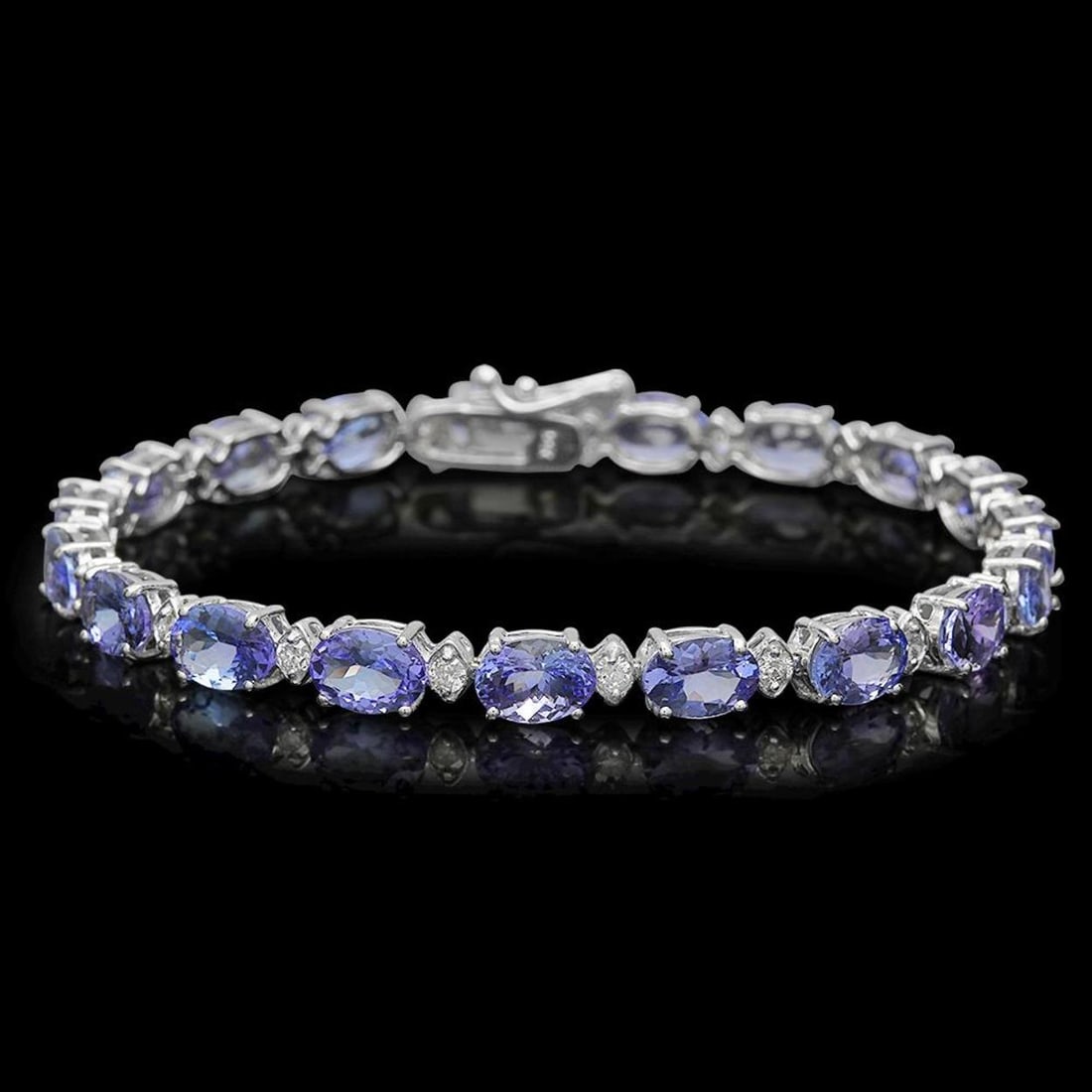 14K Gold 14.34ct Tanzanite 0.86ct Diamond Bracelet: Retail: $12,235.00 ****** 14K Gold 14.34ct Tanzanite 0.86ct Diamond Bracelet ****** Metal: 14K Solid Gold / Total Item Weight: 10.2 grams / Country Made: United States / / Main Stone: Tanzanite / Colo