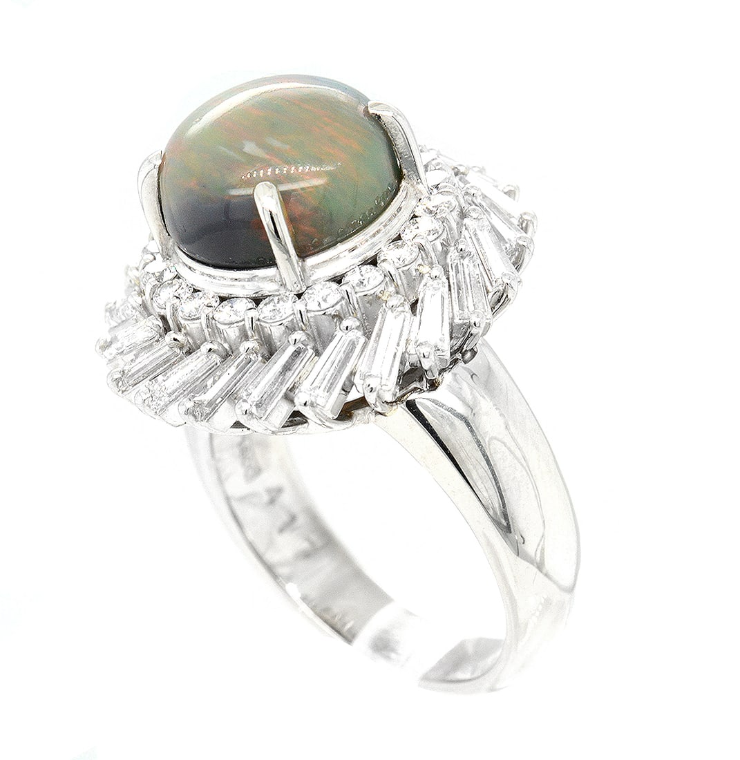 Platinum Ladies Ring with 4.17ct Opal and 1.53tcw Adjacent Diamonds: Retail: $17,225.00 ****** Platinum Ladies Ring with 4.17ct Opal and 1.53tcw Adjacent Diamonds ****** Size: 6 (we offer free resizing to winning bidders) / Metal: Platinum / Total Item Weight: 13.6 Gra
