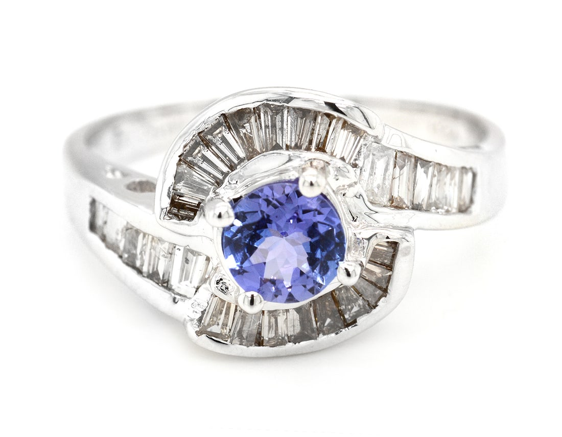18K White Gold Ladies Ring with 0.48ct Tanzanite and 0.57tcw Adjacent Diamonds: Retail: $5,100.00 ****** 18K White Gold Ladies Ring with 0.48ct Tanzanite and 0.57tcw Adjacent Diamonds ****** Size: 6.5 / Metal: 18K White Gold / Total Item Weight: 4.2 Grams / Country Made: United