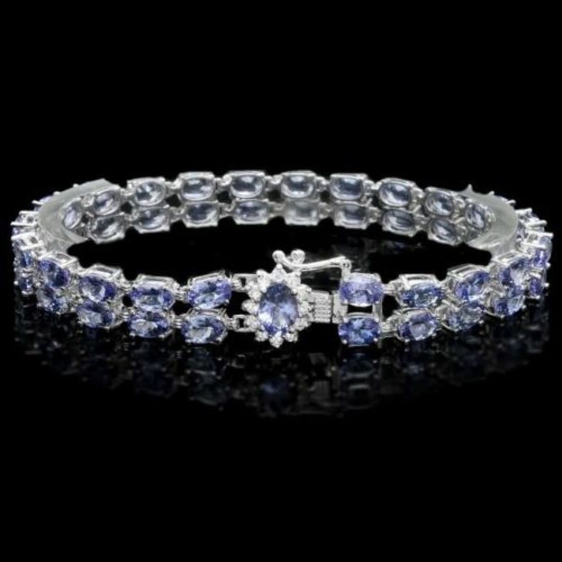 14K Gold 20.09ct Tanzanite 0.34ct Diamond Bracelet: Retail: $12,675.00 ****** 14K Gold 20.09ct Tanzanite 0.34ct Diamond Bracelet ****** Metal: 14K White Gold / Total Item Weight: 18.0 Grams / Country Made: United States / / Main Stone: Tanzanite / Colo