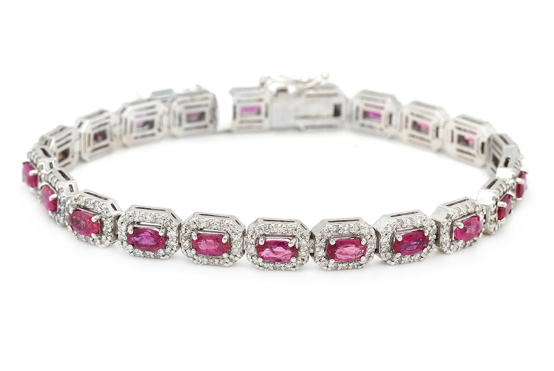 18K White Gold Ladies Bracelet with 6.8tcw Rubies and 2.85tcw Adjacent Diamonds: Retail: $14,700.00 ****** 18K White Gold Ladies Bracelet with 6.8tcw Rubies and 2.85tcw Adjacent Diamonds ****** Size: 7 / Metal: 18K White Gold / Total Item Weight: 16.8 Grams / Country Made: United