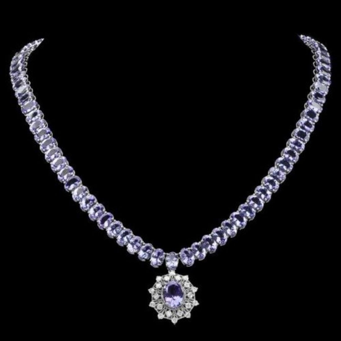 14K White Gold 63.85ct Tanzanite and 0.93ct Diamond Necklace: Retail: $44,673.00 ****** 14K White Gold 63.85ct Tanzanite and 0.93ct Diamond Necklace ****** Metal: 14K White Gold / Total Item Weight: 40.3 Grams / Country Made: United States / / Main Stone: Tanzan