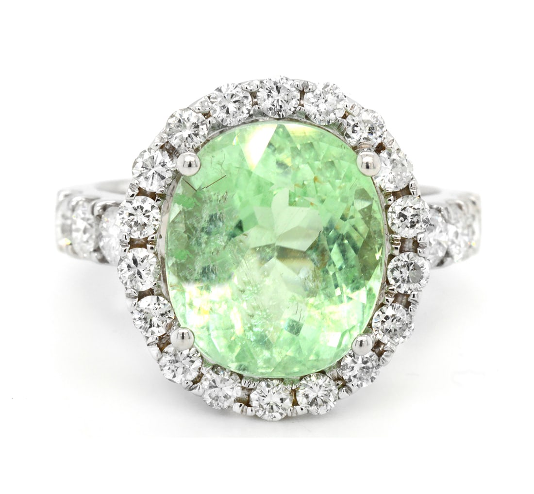 18K White Gold Ladies Ring with 6.40ct GIA Certified Tourmaline Paraiba and 1.06ct tw Adjacent: Retail: $42,500.00 ****** 18K White Gold Ladies Ring with 6.40ct GIA Certified Tourmaline Paraiba and 1.06ct tw Adjacent Diamonds ****** Size: 6.5 / Metal: 18K White Gold / Total Item Weight: 6.8