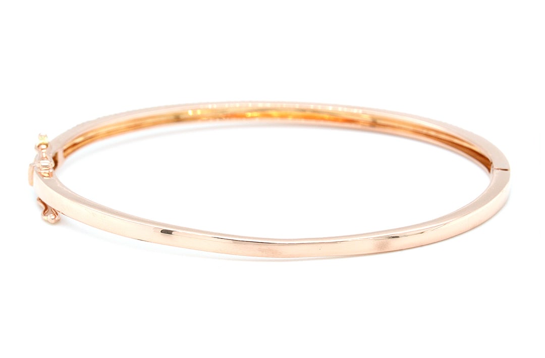 14K Rose Gold Bangle Bracelet with 1.10tcw Diamonds: Retail: $5,940.00 ****** 14K Rose Gold Bangle Bracelet with 1.10tcw Diamonds ****** Size: 2.5 by 2" / Metal: 14K Rose Gold / Total Item Weight: 8.0 Grams / Country Made: United States / / Main