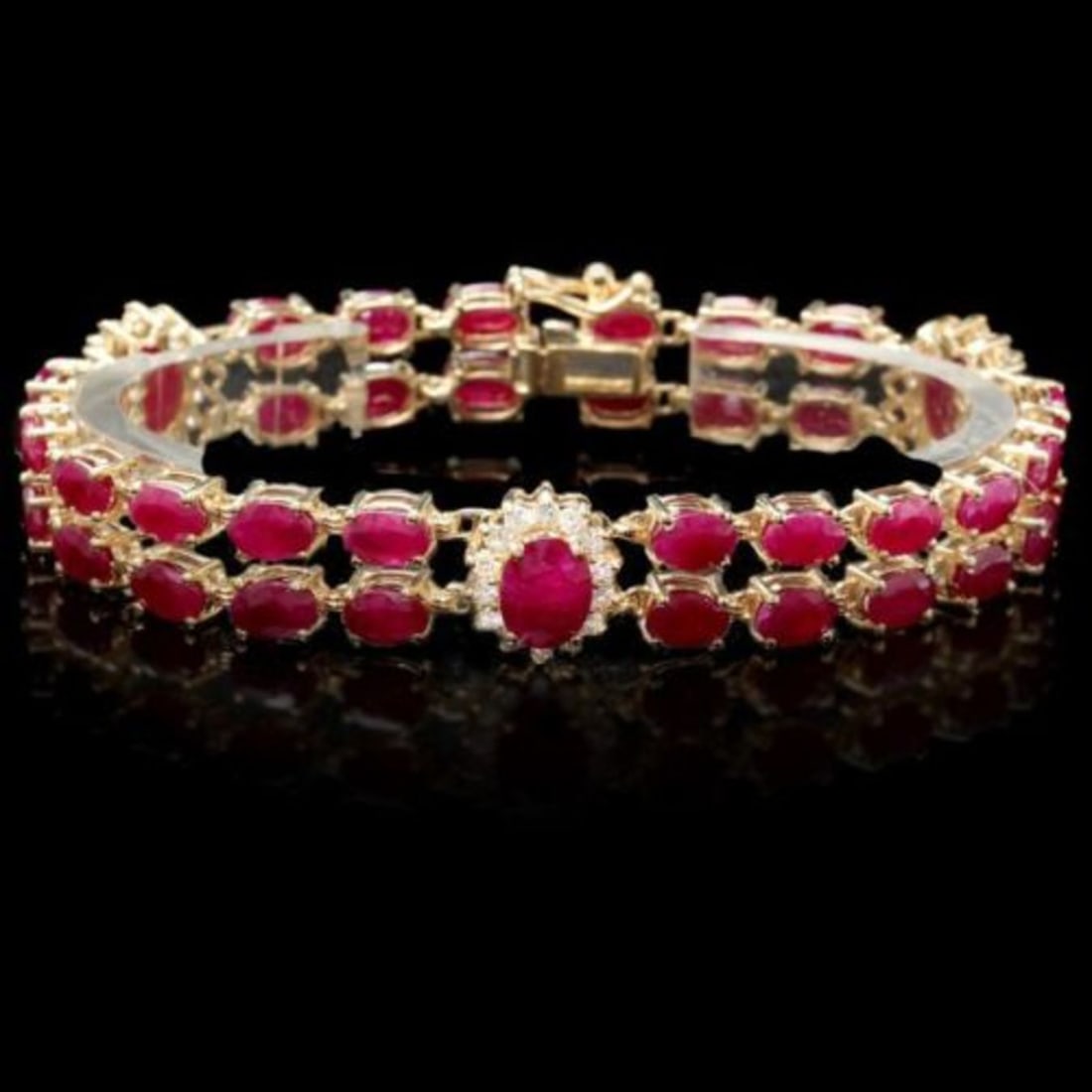 14K Gold 26.21ct Ruby 1.27ct Diamond Bracelet: Retail: $21,000.00 ****** 14K Gold 26.21ct Ruby 1.27ct Diamond Bracelet ****** Metal: 14K Yellow Gold / Total Item Weight: 20.5 Grams / Country Made: United States / / Main Stone: Ruby / Color: Red