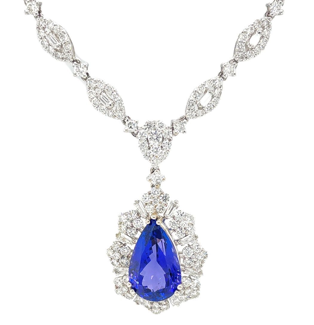 18K White Gold Ladies Necklace with 5.12ct Tanzanite and 7.33ct tw Adjacent Diamonds: Retail: $30,000.00 ****** 18K White Gold Ladies Necklace with 5.12ct Tanzanite and 7.33ct tw Adjacent Diamonds ****** Size: 6.5 / Metal: 18K White Gold / Total Item Weight: 21.3 Grams / Country Made: