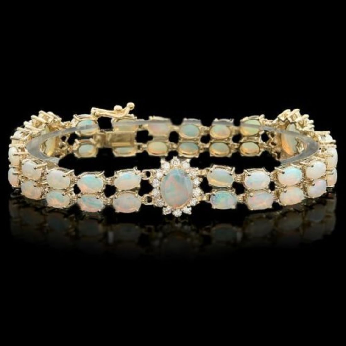 14K Gold 12.13ct Opal 1.39ct Diamond Bracelet: Retail: $15,655.00 ****** 14K Gold 12.13ct Opal 1.39ct Diamond Bracelet ****** Metal: 14K Yellow Gold / Total Item Weight: 21.0 Grams / Country Made: United States / / Main Stone: Opal / Color: Play