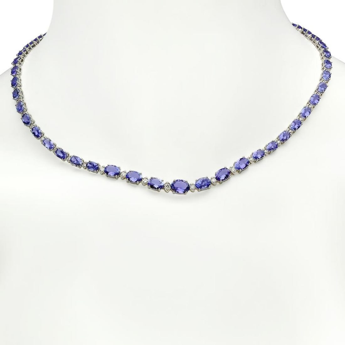 14K Gold 23.76ct Tanzanite 0.99ct Diamond Necklace: Retail: $20,363.00 ****** 14K Gold 23.76ct Tanzanite 0.99ct Diamond Necklace ****** Metal: 14K Solid Gold / Total Item Weight: 20.1 grams / Country Made: United States / / Main Stone: Tanzanite /