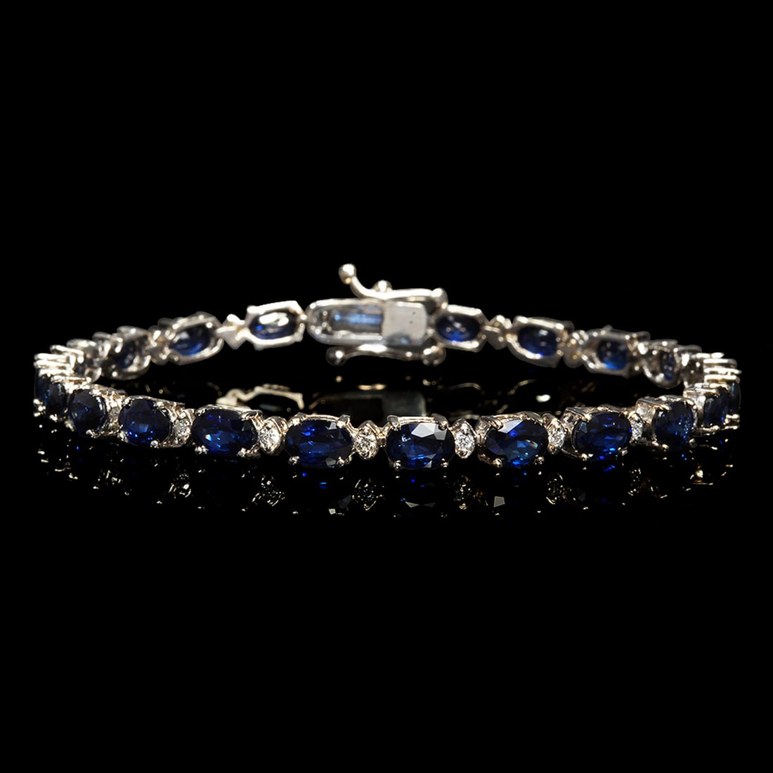 14k White Gold 12.37ct Sapphire 0.54ct Diamond Bracelet: Retail: $7,520.00 ****** 14k White Gold 12.37ct Sapphire 0.54ct Diamond Bracelet ****** Metal: 14K White Gold / Total Item Weight: 9.6 grams / Country Made: United States / / Main Stone: Sapphire /