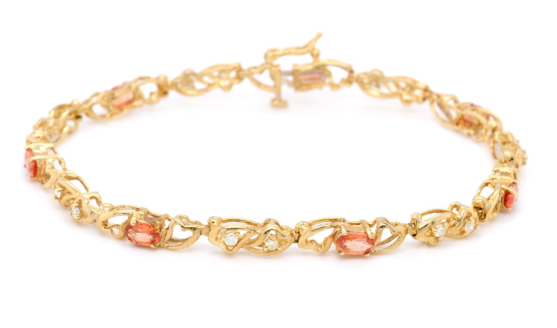 14K Yellow Gold Ladies Bracelet with 2.0tcw Orange Sapphire and 0.30tcw Diamonds: Retail: $6,500.00 ****** 14K Yellow Gold Ladies Bracelet with 2.0tcw Orange Sapphire and 0.30tcw Diamonds ****** Size: 7 / Metal: 14K Yellow Gold / Total Item Weight: 8.7 Grams / Country Made: United