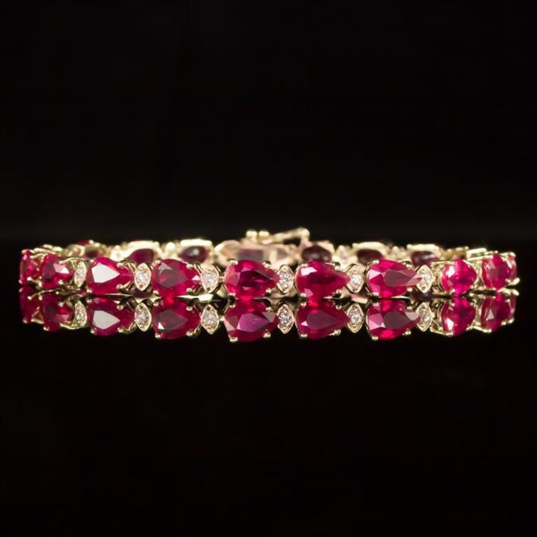 14K Gold 16.35ct Ruby 0.68ct Diamond Bracelet: Retail: $9,270.00 ****** 14K Gold 16.35ct Ruby 0.68ct Diamond Bracelet ****** Metal: 14k Solid Yellow Gold / Total Item Weight: 10.9 grams / Country Made: United States / / Main Stone: Ruby / Color: R