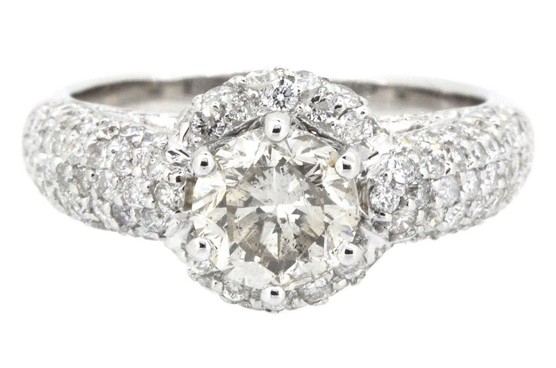 18K White Gold Ladies Ring with 1.24ct center Round Diamond and 1.19ct tw Adjacent Diamonds: Retail: $9,000.00 ****** 18K White Gold Ladies Ring with 1.24ct center Round Diamond and 1.19ct tw Adjacent Diamonds ****** Size: 6.5 / Metal: 18K White Gold / Total Item Weight: 6.2 Grams / Country M
