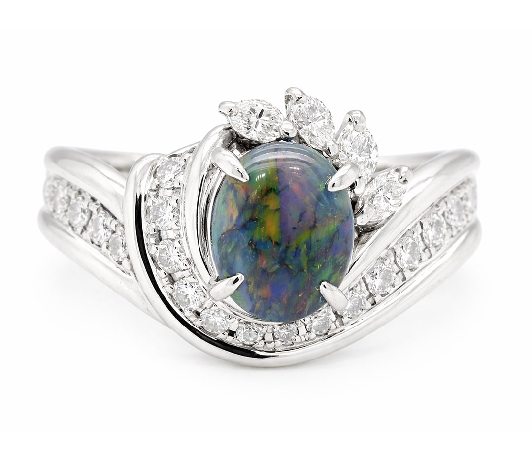 Platinum Ladies Ring with 1.18ct Opal and 0.50tcw Adjacent Diamonds: Retail: $8,550.00 ****** Platinum Ladies Ring with 1.18ct Opal and 0.50tcw Adjacent Diamonds ****** Size: 7 (we offer free resizing to winning bidders) / Metal: Platinum / Total Item Weight: 11.6 Gram