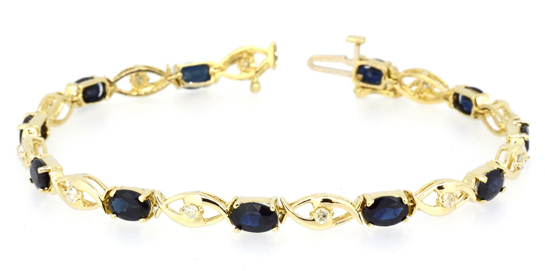 14K Yellow Gold Ladies Bracelet with 6.20ct Sapphire and 0.38ct tw Adjacent Diamonds: Retail: $3,000.00 ****** 14K Yellow Gold Ladies Bracelet with 6.20ct Sapphire and 0.38ct tw Adjacent Diamonds ****** Size: 7 / Metal: 14K Yellow Gold / Total Item Weight: 8.1 Grams / Country Made: Uni