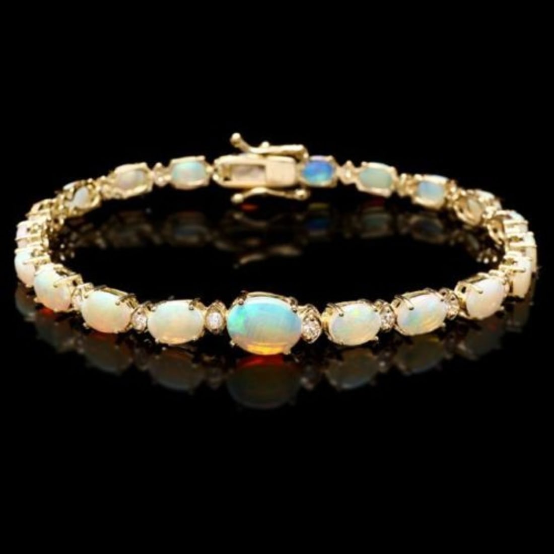 14K Gold 7.30ct Opal 0.56ct Diamond Bracelet: Retail: $9,625.00 ****** 14K Gold 7.30ct Opal 0.56ct Diamond Bracelet ****** Metal: 14K Yellow Gold / Total Item Weight: 9.5 Grams / Country Made: United States / / Main Stone: Opal / Color: Play of C