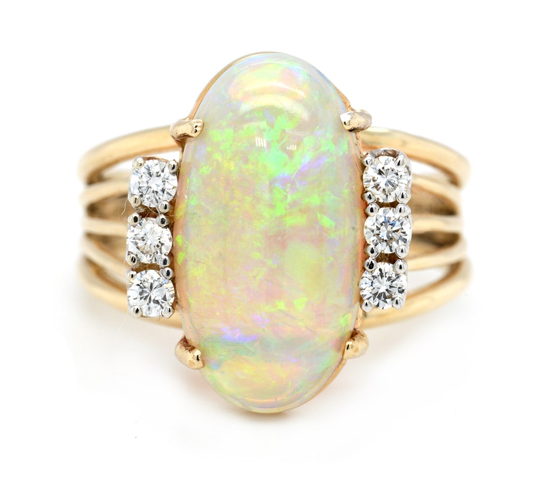14K Yellow Gold Ladies Ring with 4.2ct Australian Opal and 0.30tcw Adjacent Diamonds: Retail: $6,500.00 ****** 14K Yellow Gold Ladies Ring with 4.2ct Australian Opal and 0.30tcw Adjacent Diamonds ****** Size: 7 / Metal: 14K Yellow Gold / Total Item Weight: 5.2 Grams / Country Made: