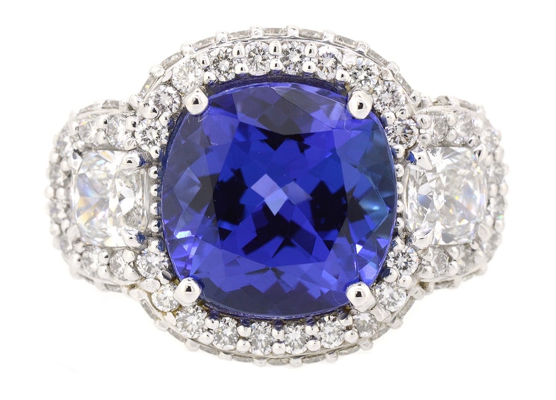 18K White Gold Ladies Ring with 5.61ct Tanzanite and 3.07tw Diamonds: Retail: $35,000.00 ****** 18K White Gold Ladies Ring with 5.61ct Tanzanite and 3.07tw Diamonds ****** Size: 6.5 / Metal: 18K White Gold / Total Item Weight: 9.9 Grams / Country Made: United States /