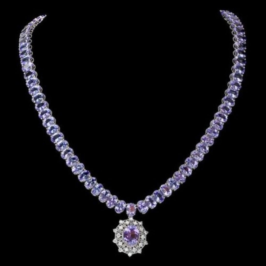 14K White Gold 71.93ct Tanzanite and 0.72ct Diamond Necklace: Retail: $37,290.00 ****** 14K White Gold 71.93ct Tanzanite and 0.72ct Diamond Necklace ****** Metal: 14K White Gold / Total Item Weight: 40.0 Grams / Country Made: United States / / Main Stone: