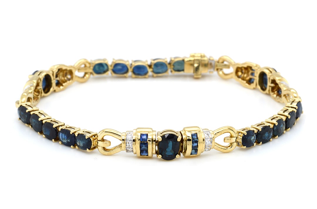 18K Yellow Gold Ladies Bracelet with 5.67ct Blue Sapphires and 0.20tcw Diamonds: Retail: $13,000.00 ****** 18K Yellow Gold Ladies Bracelet with 5.67ct Blue Sapphires and 0.20tcw Diamonds ****** Size: 7 / Metal: 18K Yellow Gold / Total Item Weight: 15.3 Grams / Country Made: United