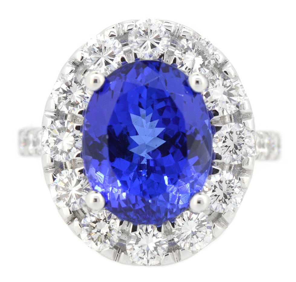18K White Gold Ladies Ring with 6.24ct Tanzanite and 1.85ct Adjacent Diamonds: Retail: $20,000.00 ****** 18K White Gold Ladies Ring with 6.24ct Tanzanite and 1.85ct Adjacent Diamonds ****** Size: 6.5 / Metal: 18K White Gold / Total Item Weight: 9.2 Grams / Country Made: United