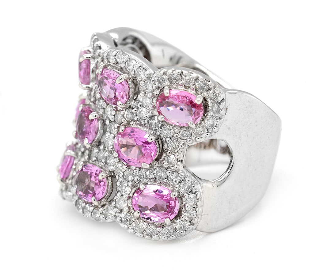 18K White Gold Ladies Ring with 4.17tcw Pink Sapphires and 1.31tcw Adjacent Diamonds: Retail: $19,688.00 ****** 18K White Gold Ladies Ring with 4.17tcw Pink Sapphires and 1.31tcw Adjacent Diamonds ****** Size: 8 (We offer free resizing to winning bidders) / Metal: 18K White Gold /