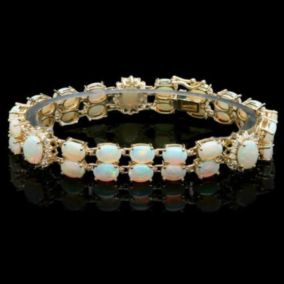 14K Gold 17.65ct Opal 1.13ct Diamond Bracelet: Retail: $18,650.00 ****** 14K Gold 17.65ct Opal 1.13ct Diamond Bracelet ****** Metal: 14K Yellow Gold / Total Item Weight: 22.5 Grams / Country Made: United States / / Main Stone: Opal / Color: Play