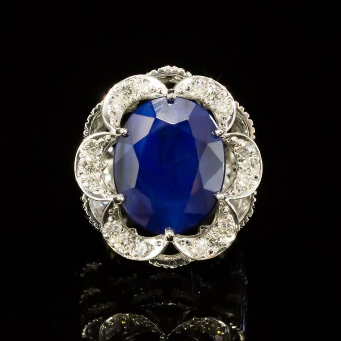 14K White Gold 12.17ct Sapphire and 0.82ct Diamond Ring: Retail: $10,200.00 ****** 14K White Gold 12.17ct Sapphire and 0.82ct Diamond Ring ****** Metal: 14K White Gold / Total Item Weight: 17.9 Grams / Country Made: United States / / Main Stone: Sapphire /