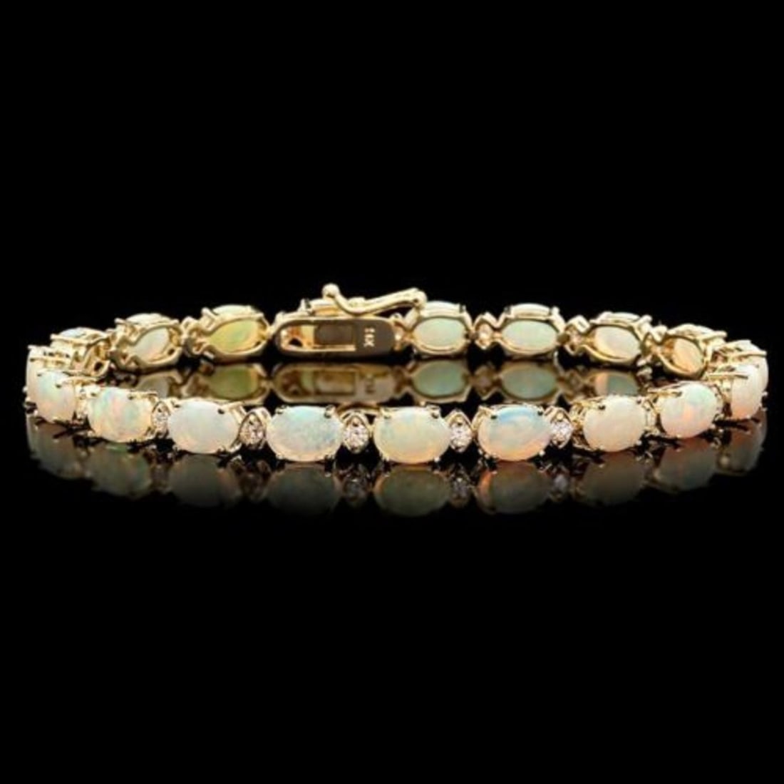 14K Gold 8.62ct Opal 0.82ct Diamond Bracelet: Retail: $14,525.00 ****** 14K Gold 8.62ct Opal 0.82ct Diamond Bracelet ****** Metal: 14K Yellow Gold / Total Item Weight: 10.0 Grams / Country Made: United States / / Main Stone: Opal / Color: Play of