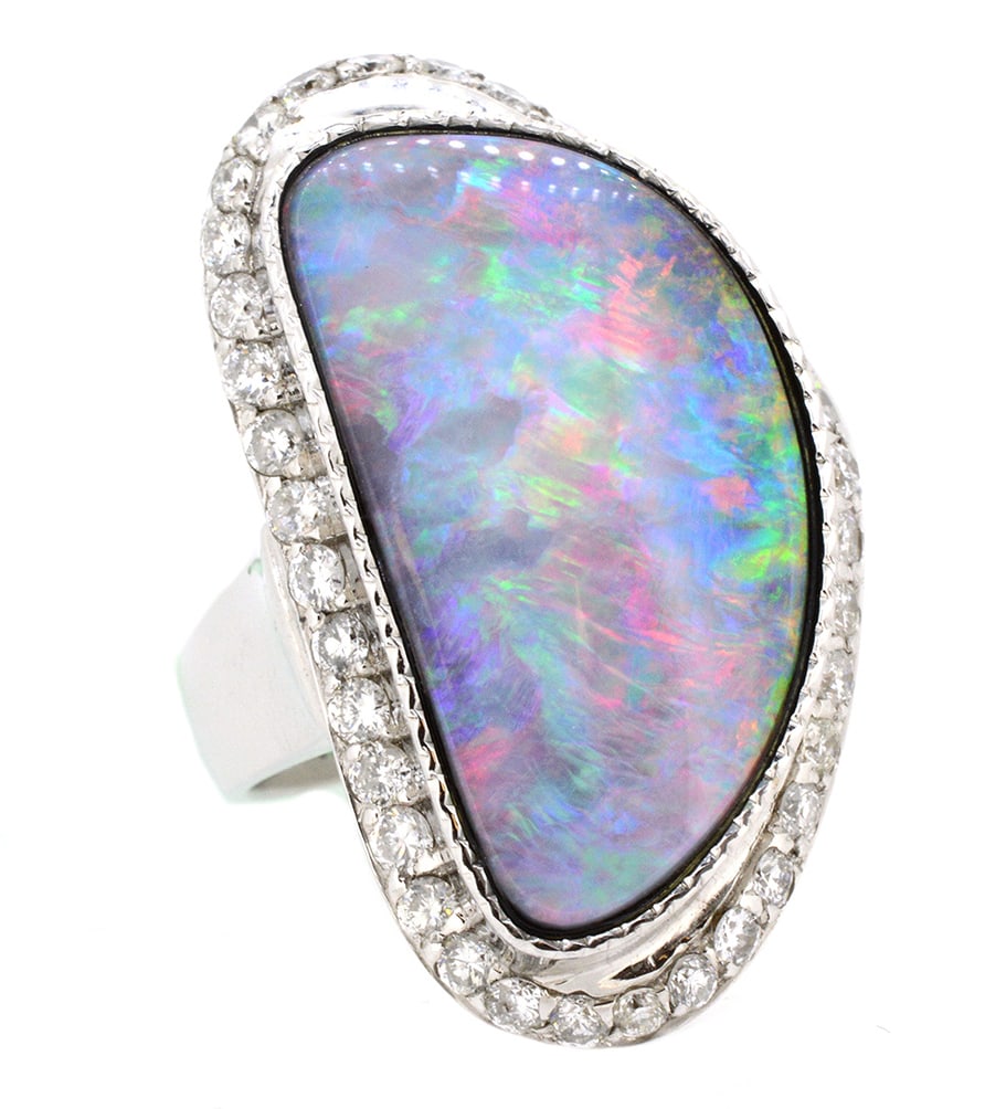 18K White Gold Ladies Ring with 22.41ct Boulder Opal and 1.16ct tw Adjacent Diamonds: Retail: $15,000.00 ****** 18K White Gold Ladies Ring with 22.41ct Boulder Opal and 1.16ct tw Adjacent Diamonds ****** Size: 6.5 / Metal: 18K White Gold / Total Item Weight: 19.79 Grams / Country Made: