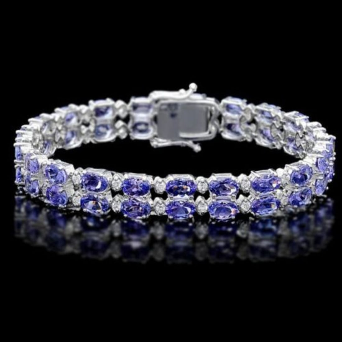 14K Gold 20.20ct Tanzanite 1.34ct Diamond Bracelet: Retail: $20,715.00 ****** 14K Gold 20.20ct Tanzanite 1.34ct Diamond Bracelet ****** Metal: 14K White Gold / Total Item Weight: 21.5 Grams / Country Made: United States / / Main Stone: Tanzanite / Colo