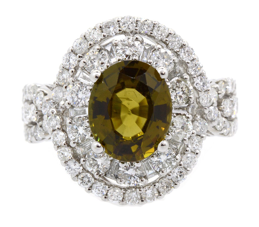 18K White Gold Ladies Ring with 2.57ct GIA Certified Sinhalite and 1.77ct tw Adjacent Diamonds: Retail: $9,500.00 ****** 18K White Gold Ladies Ring with 2.57ct GIA Certified Sinhalite and 1.77ct tw Adjacent Diamonds ****** Size: 6.5 / Metal: 18K White Gold / Total Item Weight: 6.2 Grams /