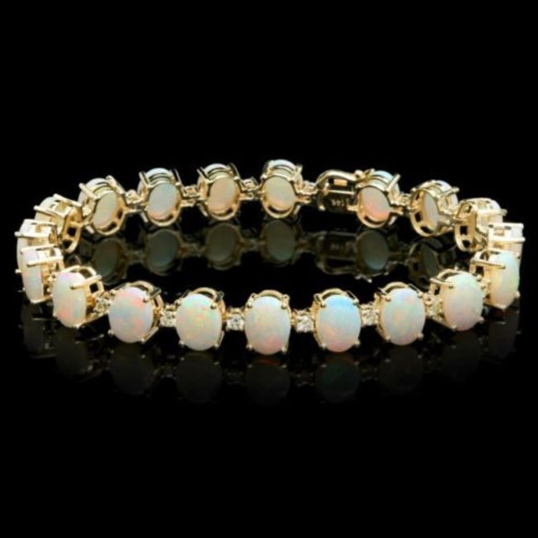 14K Gold 18.21ct Opal 1.53ct Diamond Bracelet: Retail: $18,650.00 ****** 14K Gold 18.21ct Opal 1.53ct Diamond Bracelet ****** Metal: 14K Yellow Gold / Total Item Weight: 20.0 Grams / Country Made: United States / / Main Stone: Opal / Color: Play