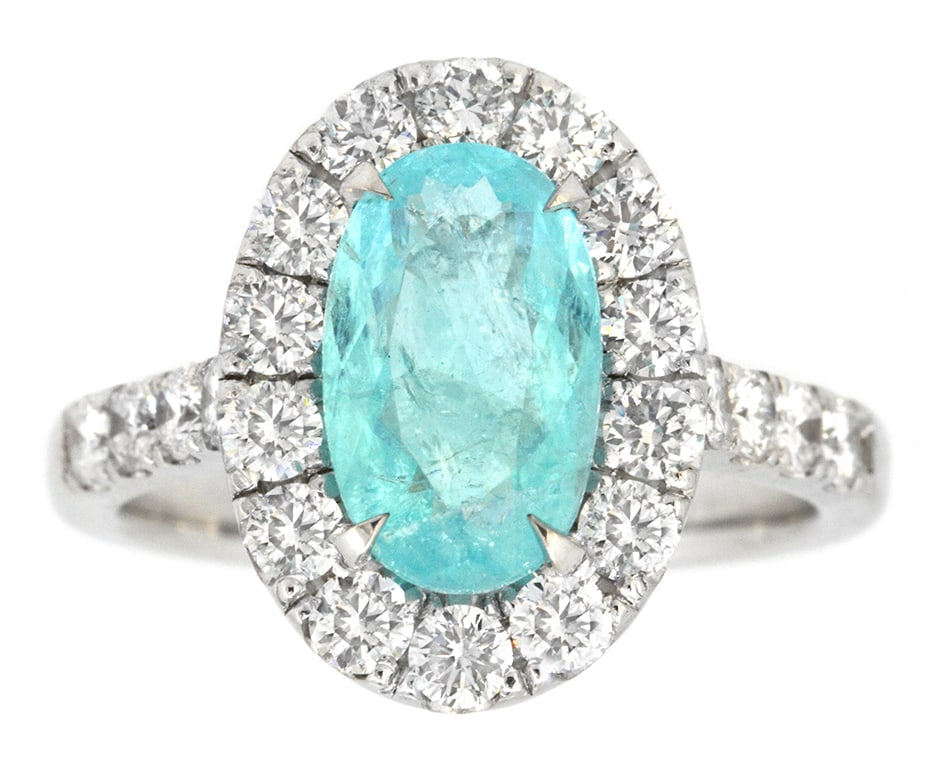 18K White Gold Ladies Ring with 1.73ct Paraiba Tourmaline and 1.01ct tw Adjacent Diamonds: Retail: $35,000.00 ****** 18K White Gold Ladies Ring with 1.73ct Paraiba Tourmaline and 1.01ct tw Adjacent Diamonds ****** Size: 6.5 / Metal: 18K White Gold / Total Item Weight: 6.1 Grams / Country Ma