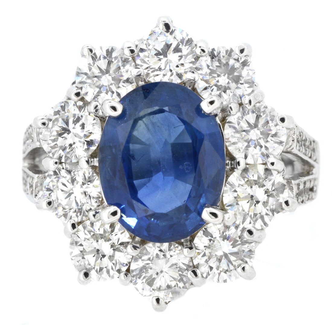 18K White Gold Ladies Ring with 3.34ct Sapphire and 2.63ct tw Adjacent Diamonds: Retail: $16,500.00 ****** 18K White Gold Ladies Ring with 3.34ct Sapphire and 2.63ct tw Adjacent Diamonds ****** Size: 6.5 / Metal: 18K White Gold / Total Item Weight: 8.1 Grams / Country Made: