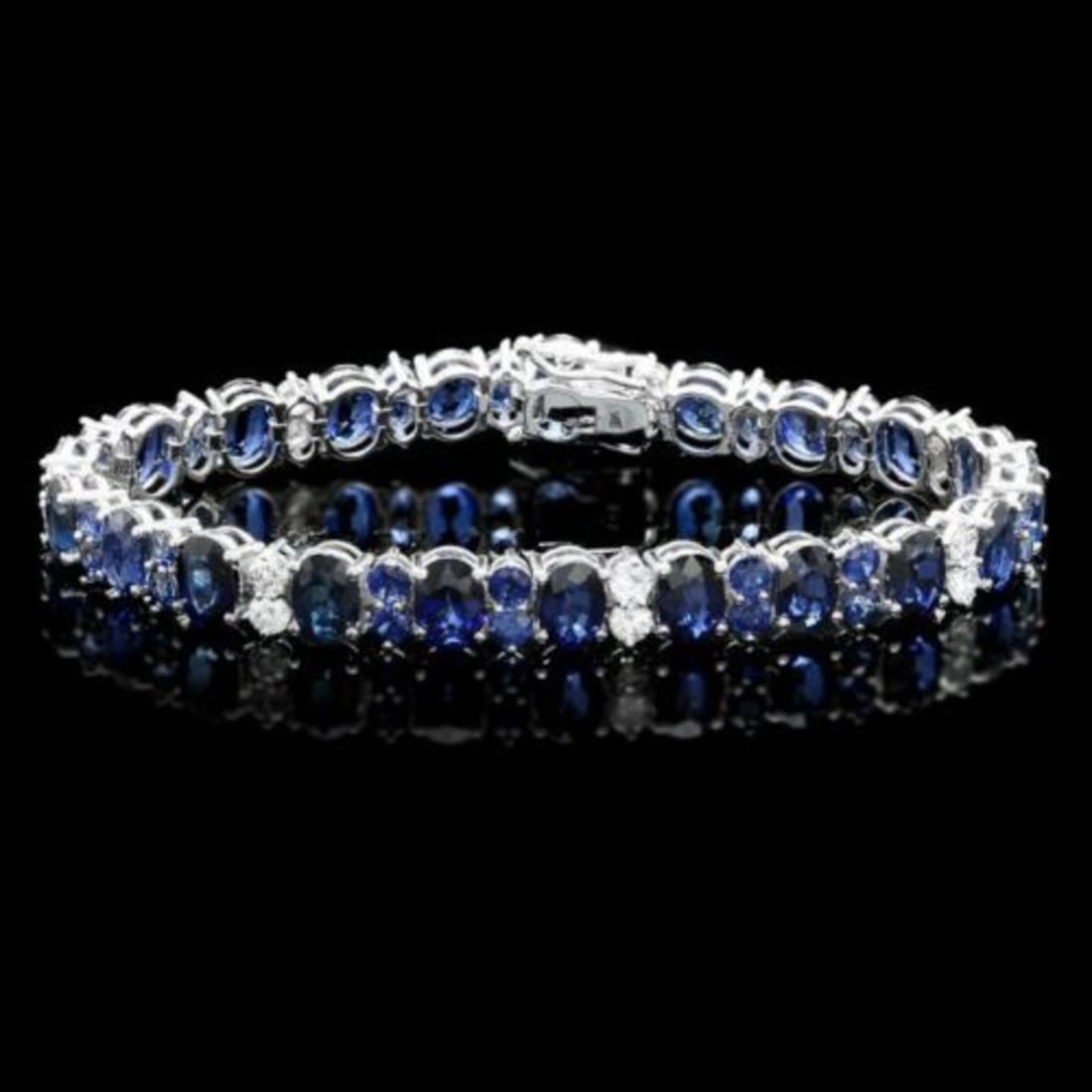 14K Gold 23.14ct Sapphire 1.68ct Diamond Bracelet: Retail: $18,750.00 ****** 14K Gold 23.14ct Sapphire 1.68ct Diamond Bracelet ****** Metal: 14K White Gold / Total Item Weight: 18.5 Grams / Country Made: United States / / Main Stone: Sapphire /