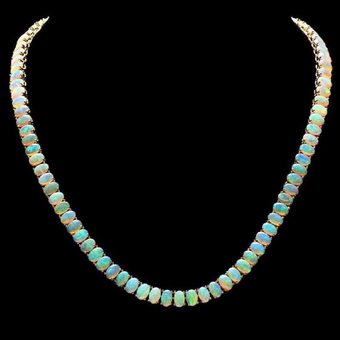 14K Yellow Gold and 29.79ct Opal Necklace: Retail: $22,550.00 ****** 14K Yellow Gold and 29.79ct Opal Necklace ****** Metal: 14K Yellow Gold / Total Item Weight: 25.0 Grams / Country Made: United States / / Main Stone: Opal / Color: Play of