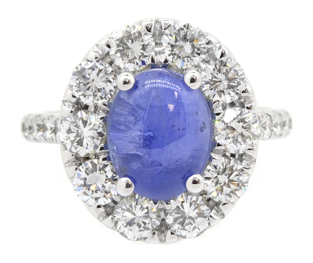18K White Gold Ladies Ring with 4.67ct GIA Certified Star Sapphire and 1.73ct tw Adjacent Diamonds: Retail: $22,500.00 ****** 18K White Gold Ladies Ring with 4.67ct GIA Certified Star Sapphire and 1.73ct tw Adjacent Diamonds ****** Size: 6.5 / Metal: 18K White Gold / Total Item Weight: 7.5 Grams /