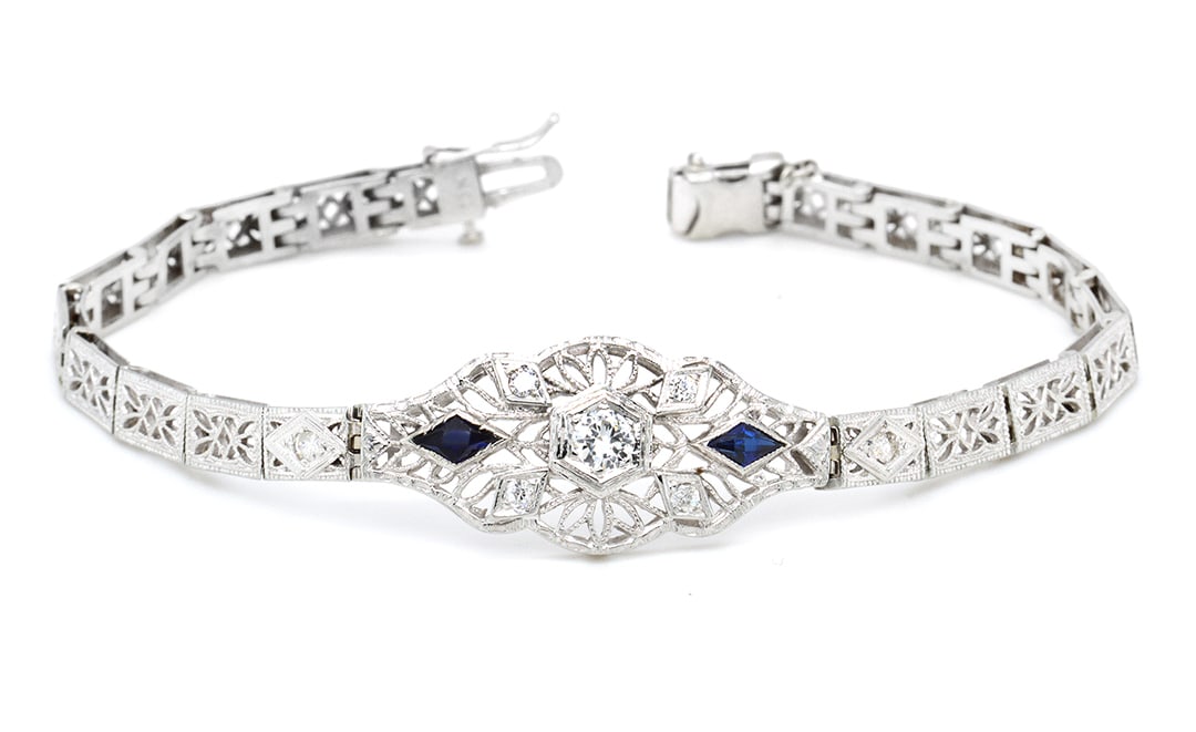 18K White Gold Ladies Bracelet with 0.05ct Sapphire and 0.50tcw Adjacent Diamonds: Retail: $13,500.00 ****** 18K White Gold Ladies Bracelet with 0.05ct Sapphire and 0.50tcw Adjacent Diamonds ****** Size: 7 / Metal: 18K White Gold / Total Item Weight: 12.3 Grams / Country Made: Unite
