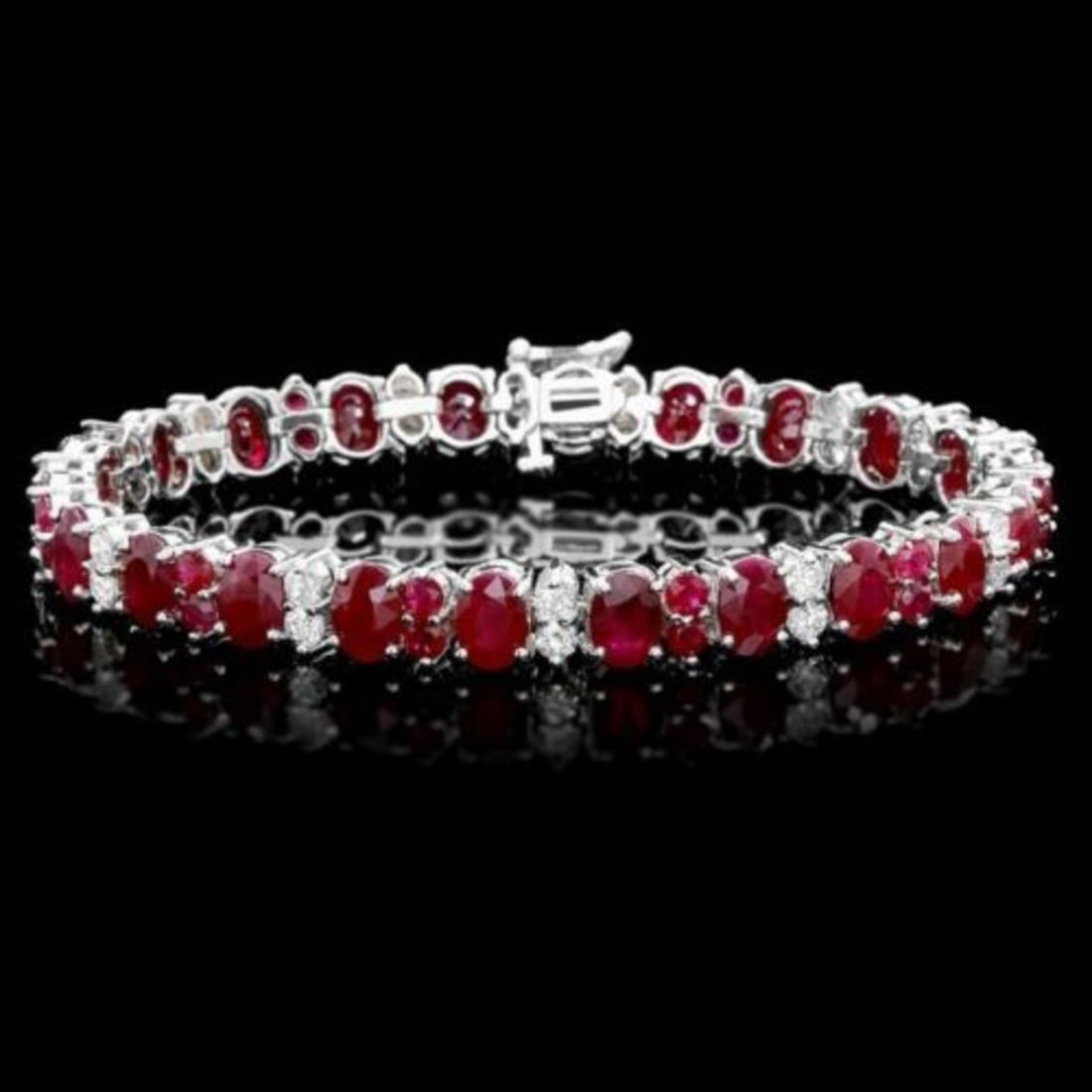 14K Gold 27.83ct Ruby 2.38ct Diamond Bracelet: Retail: $24,750.00 ****** 14K Gold 27.83ct Ruby 2.38ct Diamond Bracelet ****** Metal: 14K White Gold / Total Item Weight: 24.5 Grams / Country Made: United States / / Main Stone: Ruby / Color: Red /